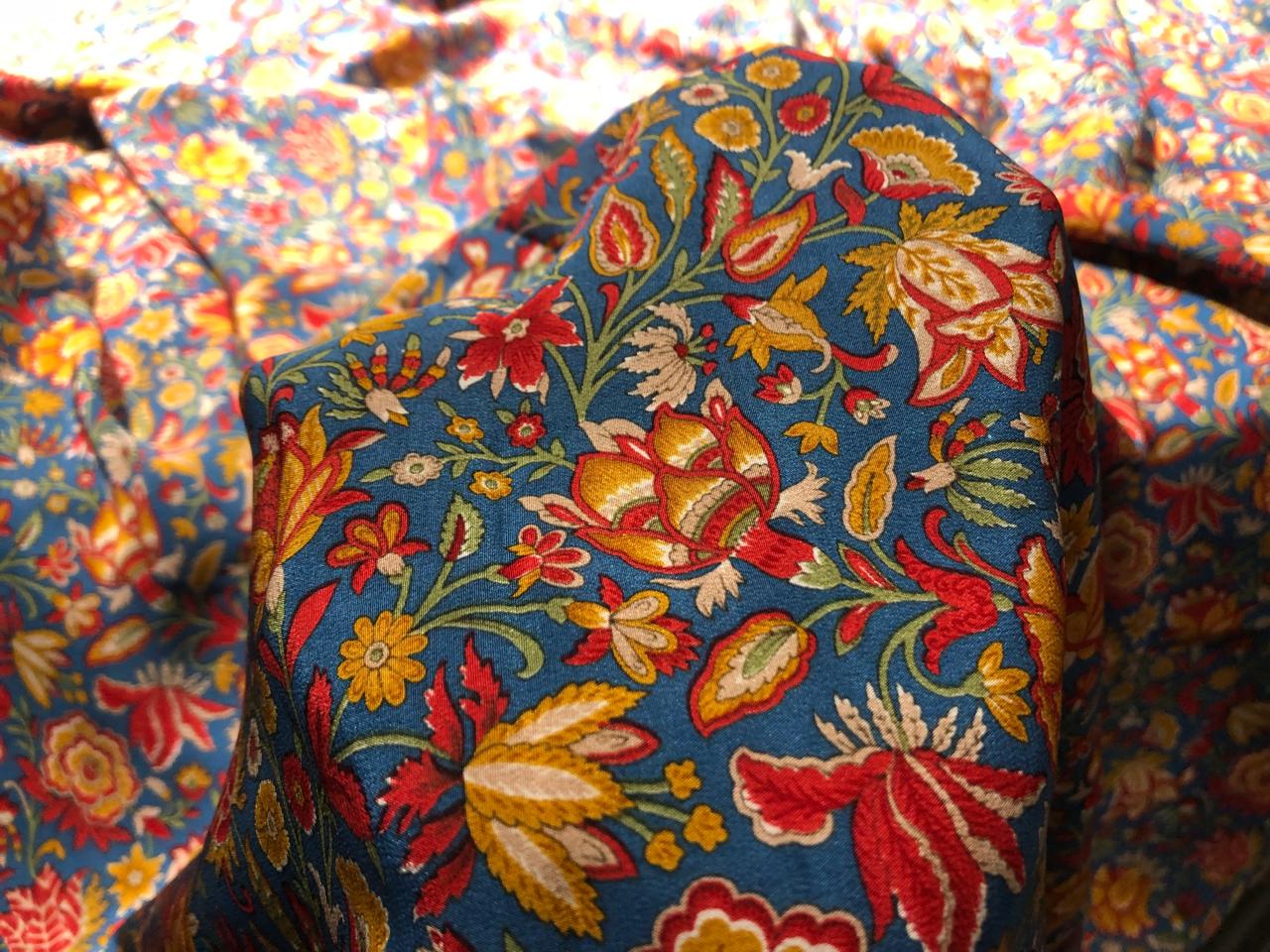 Pure silk  crepe printed fabric 21.35 momme [80gms] teal blue  with dusty orange ,red and green floral  print [16950]