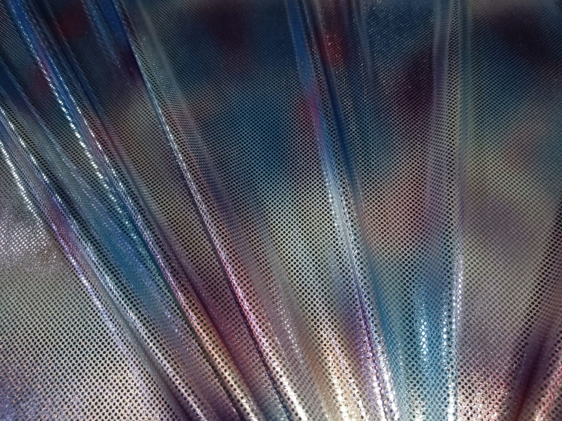 Holographic fabric available in two colors Shades of blue and lavender and green an lavender 60" wide