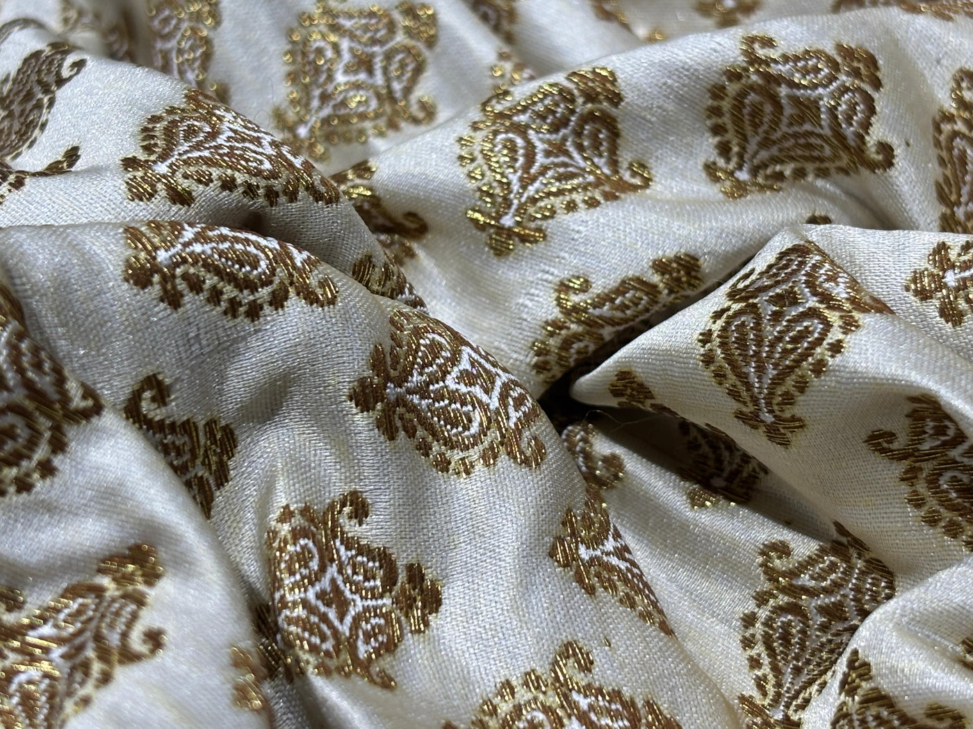 Silk Brocade fabric 44" dark ivory with antique gold jacquard motifs available in 2 designs leaf and paisley BRO1053