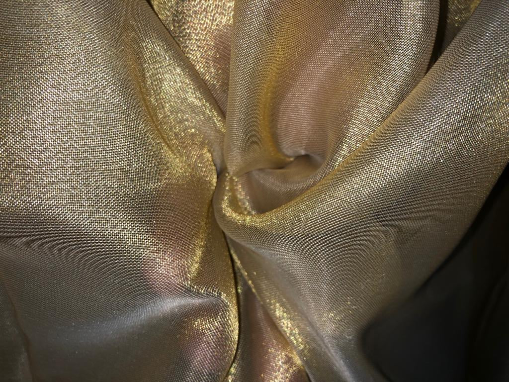 Tissue fabric 44" wide available in 14 colors copper, bright gold ,subtle gold ,neon pink ,neon green ,neon blue ,dark gold, blue x pink , white gold, blue with a hint of pink, pinkish mauve, gold x black ,copper x gold ,SILVER