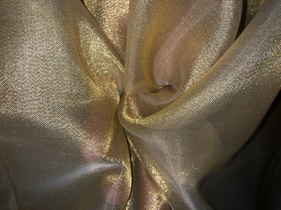 Tissue fabric 44" wide available in 14 colors copper, bright gold ,subtle gold ,neon pink ,neon green ,neon blue ,dark gold, blue x pink , white gold, blue with a hint of pink, pinkish mauve, gold x black ,copper x gold ,SILVER