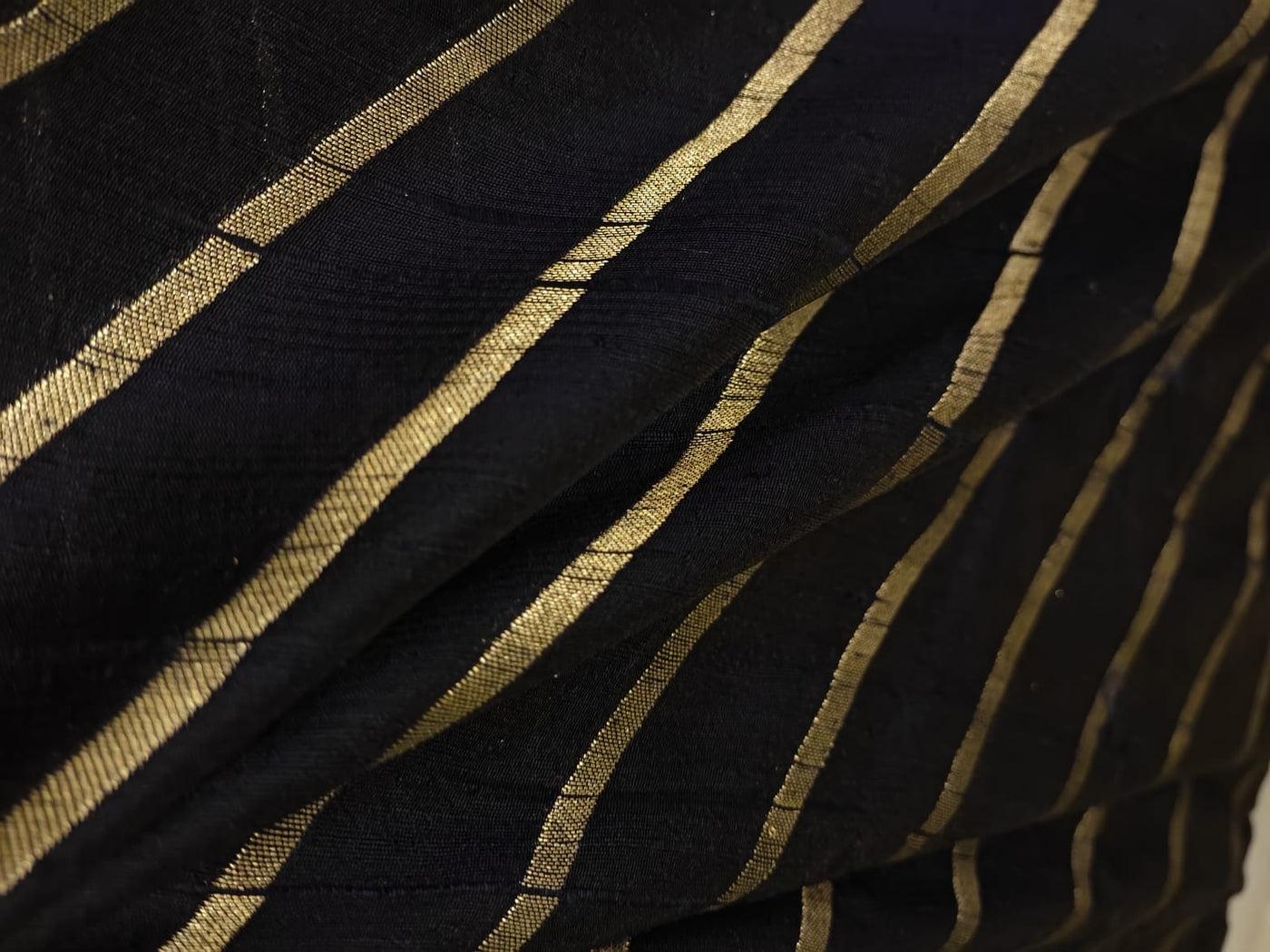 100% Silk Brocade in raw silk fabric available in 2 colors black and peacock blue with gold metallic stripe 44" wide BRO1070[3/4]