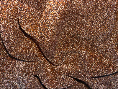Metallic Shimmer available in 3 colors bronze , black and gold with lycra fashion fabric 58" wide[15310/15313/15687]
