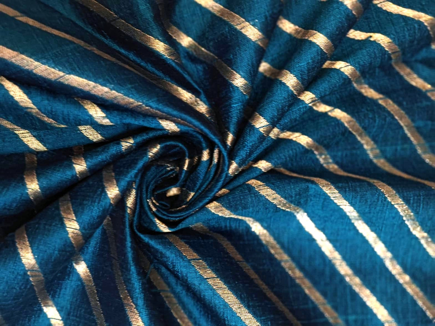 100% Silk Brocade in raw silk fabric available in 2 colors black and peacock blue with gold metallic stripe 44" wide BRO1070[3/4]