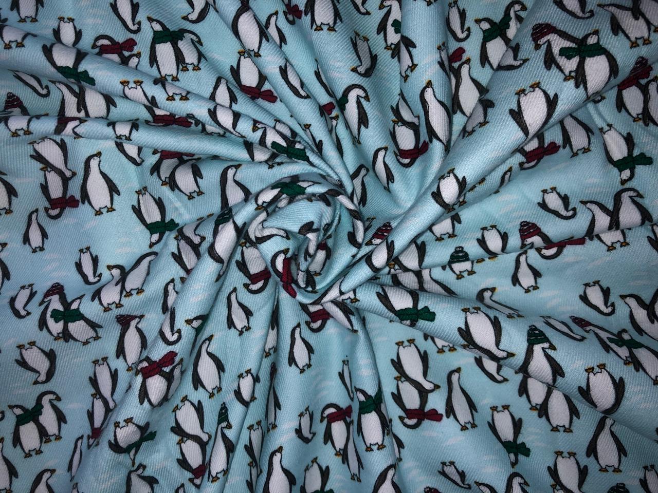 100% Cotton flannel Print 58"wide available in 3 prints penguin, snowmen and skiing on ice