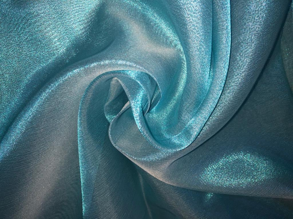 Tissue fabric 44" wide available in 14 colors copper, bright gold ,subtle gold ,neon pink ,neon green ,neon blue ,dark gold, blue x pink , white gold, blue with a hint of pink, pinkish mauve, gold x black ,copper x gold ,SILVER