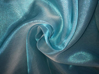 Tissue fabric 44" wide available in 14 colors copper, bright gold ,subtle gold ,neon pink ,neon green ,neon blue ,dark gold, blue x pink , white gold, blue with a hint of pink, pinkish mauve, gold x black ,copper x gold ,SILVER