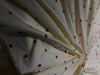 100% Cotton Poplin 58" Ivory with small red strawberry motifs [17560]