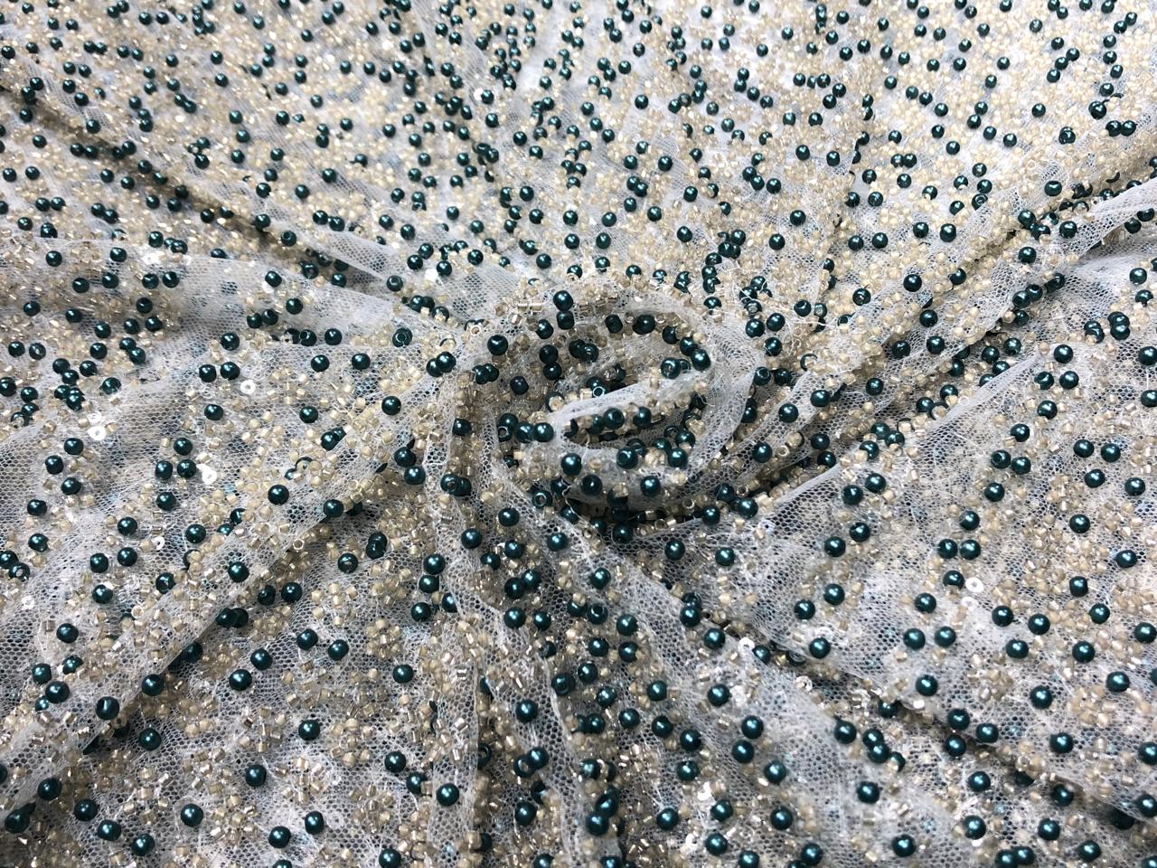 NET fabric with sequins and  pearls available in 2 colors black and white 56" wide [17807/08]