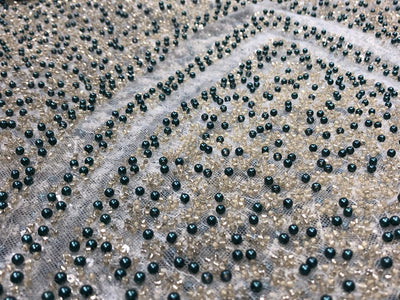 NET fabric with sequins and  pearls available in 2 colors black and white 56" wide [17807/08]