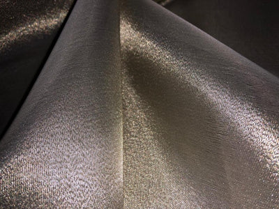 Tissue fabric 44" wide available in 14 colors copper, bright gold ,subtle gold ,neon pink ,neon green ,neon blue ,dark gold, blue x pink , white gold, blue with a hint of pink, pinkish mauve, gold x black ,copper x gold ,SILVER