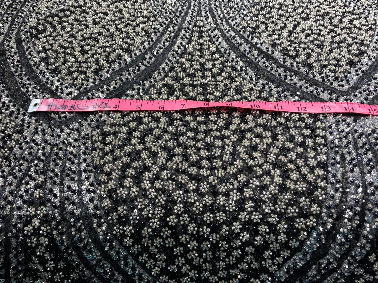 NET fabric with sequins and  pearls available in 2 colors black and white 56" wide [17807/08]