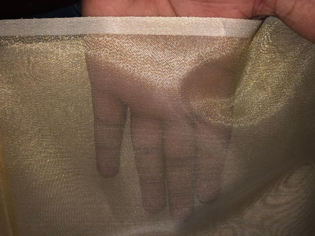 Tissue fabric 44" wide available in 14 colors copper, bright gold ,subtle gold ,neon pink ,neon green ,neon blue ,dark gold, blue x pink , white gold, blue with a hint of pink, pinkish mauve, gold x black ,copper x gold ,SILVER