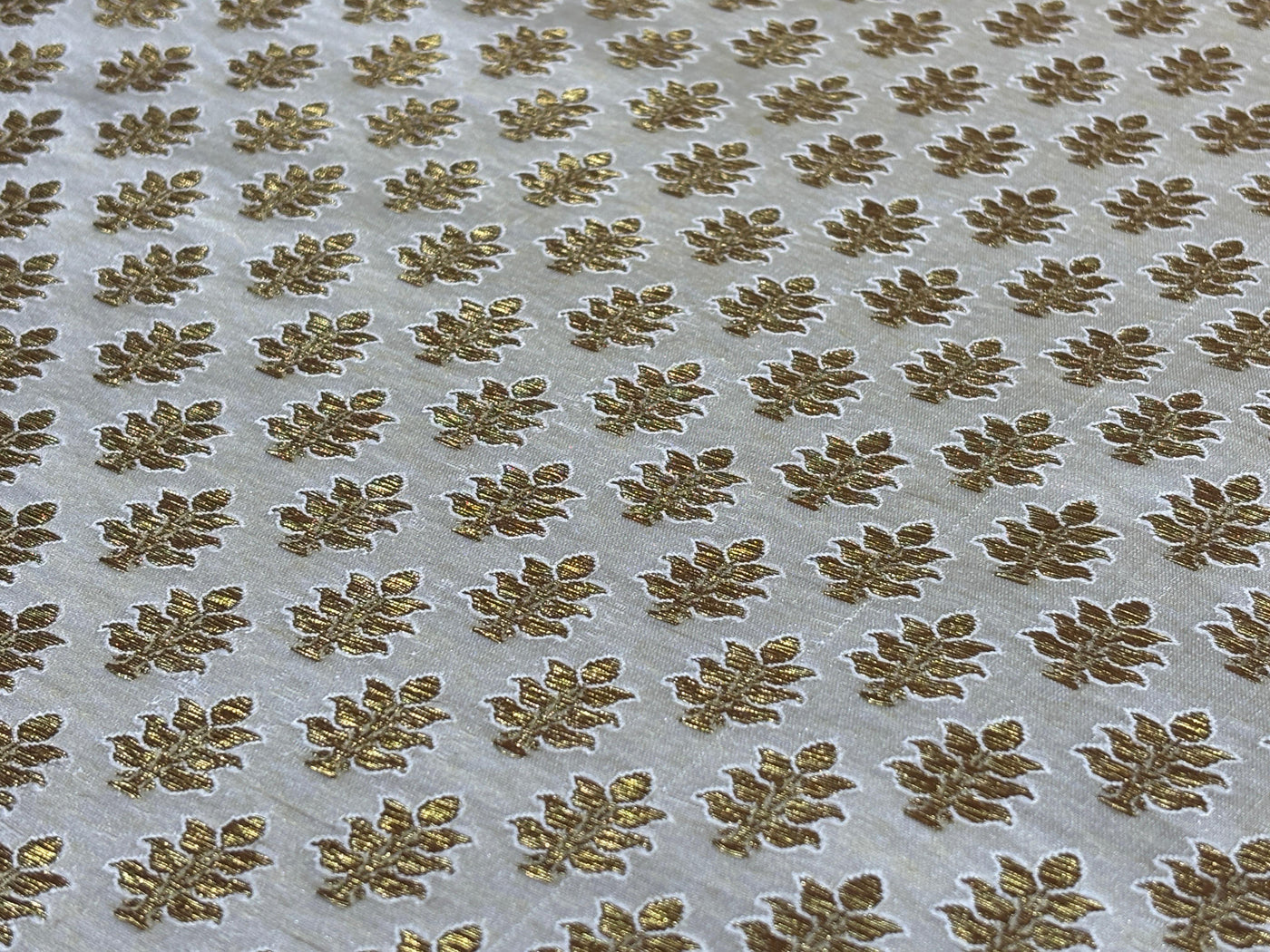 Silk Brocade fabric 44" dark ivory with antique gold jacquard motifs available in 2 designs leaf and paisley BRO1053
