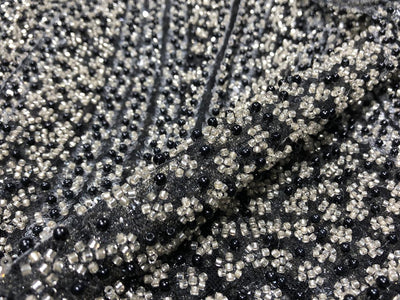 NET fabric with sequins and  pearls available in 2 colors black and white 56" wide [17807/08]