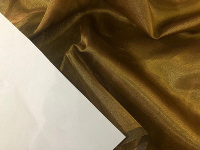 Tissue fabric 44" wide available in 14 colors copper, bright gold ,subtle gold ,neon pink ,neon green ,neon blue ,dark gold, blue x pink , white gold, blue with a hint of pink, pinkish mauve, gold x black ,copper x gold ,SILVER