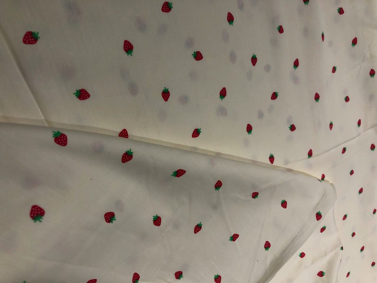 100% Cotton Poplin 58" Ivory with small red strawberry motifs [17560]