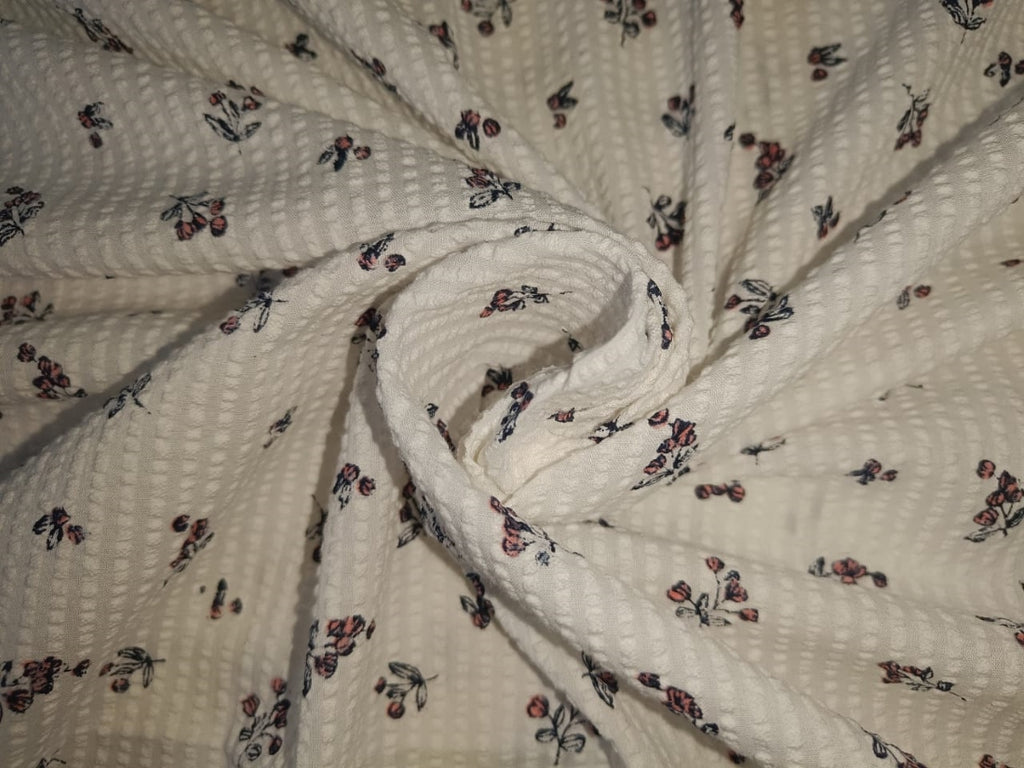 100% Cotton  Seer Sucker fabric white with floral motif color 58" wide