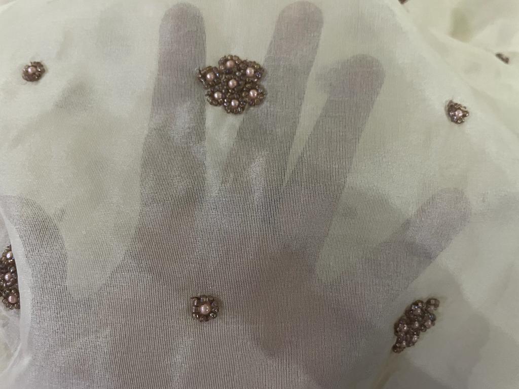 Silk organza with pearl hand embroidery Semi Sheer fabric 54" wide available in 2 colors ivory and antique gold pearls/ivory and ivory pearls ivory Silk organza with pearl hand embroidery Semi Sheer fabric 54" wide available in 2 colors ivory and antique gold pearls/ivory and ivory pearls ivory