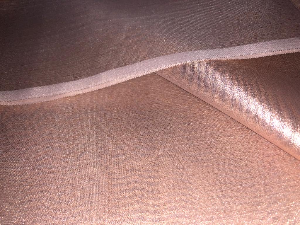 Tissue fabric 44" wide available in 14 colors copper, bright gold ,subtle gold ,neon pink ,neon green ,neon blue ,dark gold, blue x pink , white gold, blue with a hint of pink, pinkish mauve, gold x black ,copper x gold ,SILVER