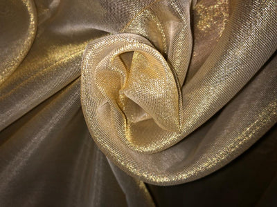 Tissue fabric 44" wide available in 14 colors copper, bright gold ,subtle gold ,neon pink ,neon green ,neon blue ,dark gold, blue x pink , white gold, blue with a hint of pink, pinkish mauve, gold x black ,copper x gold ,SILVER