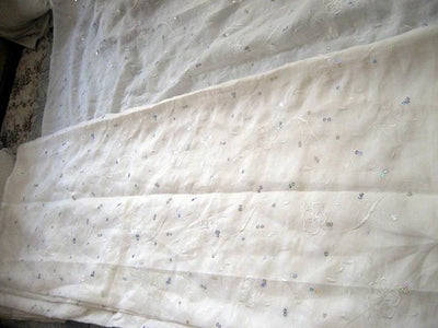 White embroidered linen with sequence 54&quot; wide~Design 1&quot;
