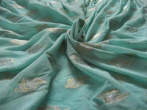 Polyester georgette fabric with metalic silver & gold jacquard~Sea Green colour