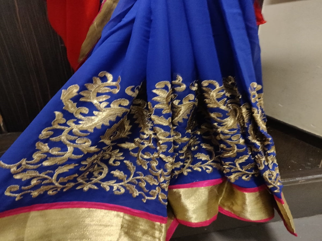 Beautiful georgette shaded pink orange and royal blue embroidered Saree