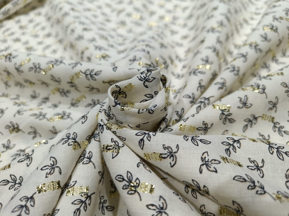 100% Cotton Print with gold metallic motif Fabric 58" wide sold by the yard.
